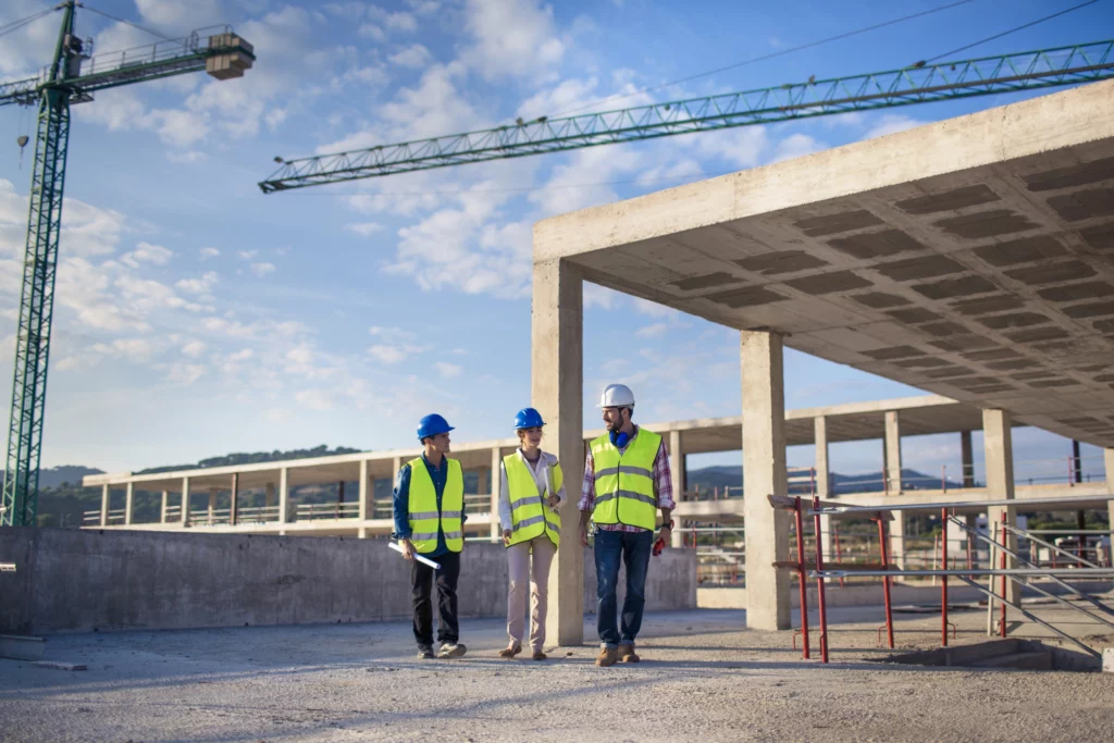 Three workers on a construction site