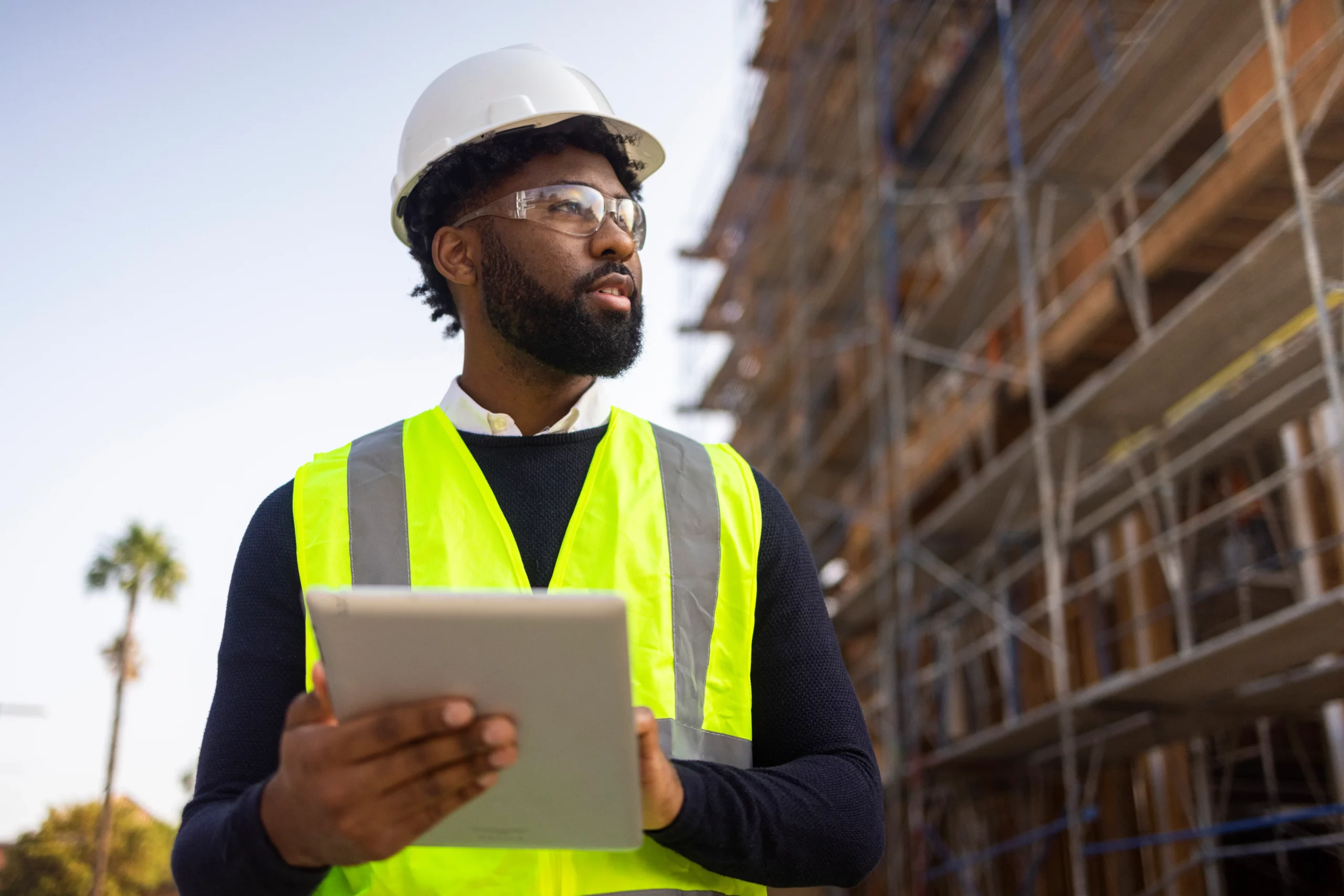 Foreman carrying out risk assessment