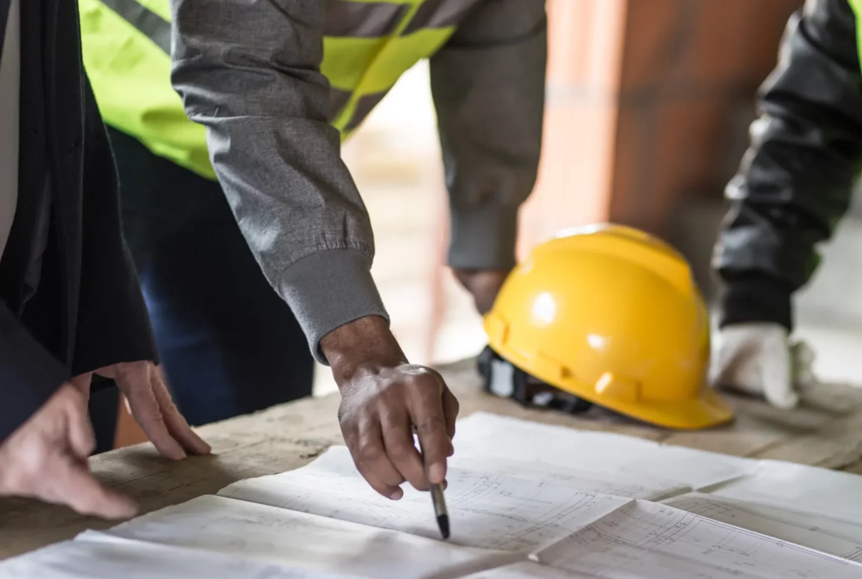 Construction workers looking at drawings