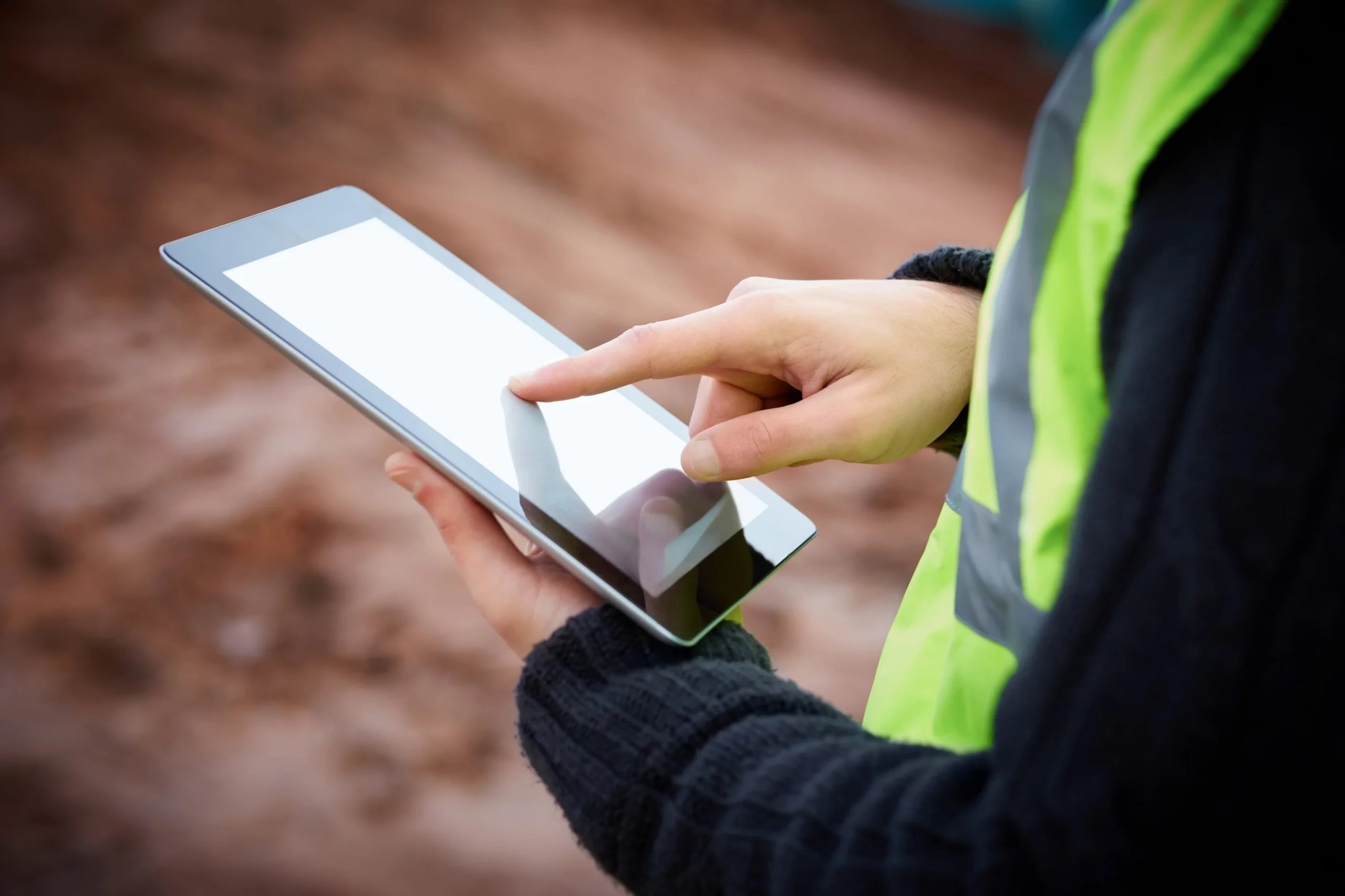 Worker using a tablet on site