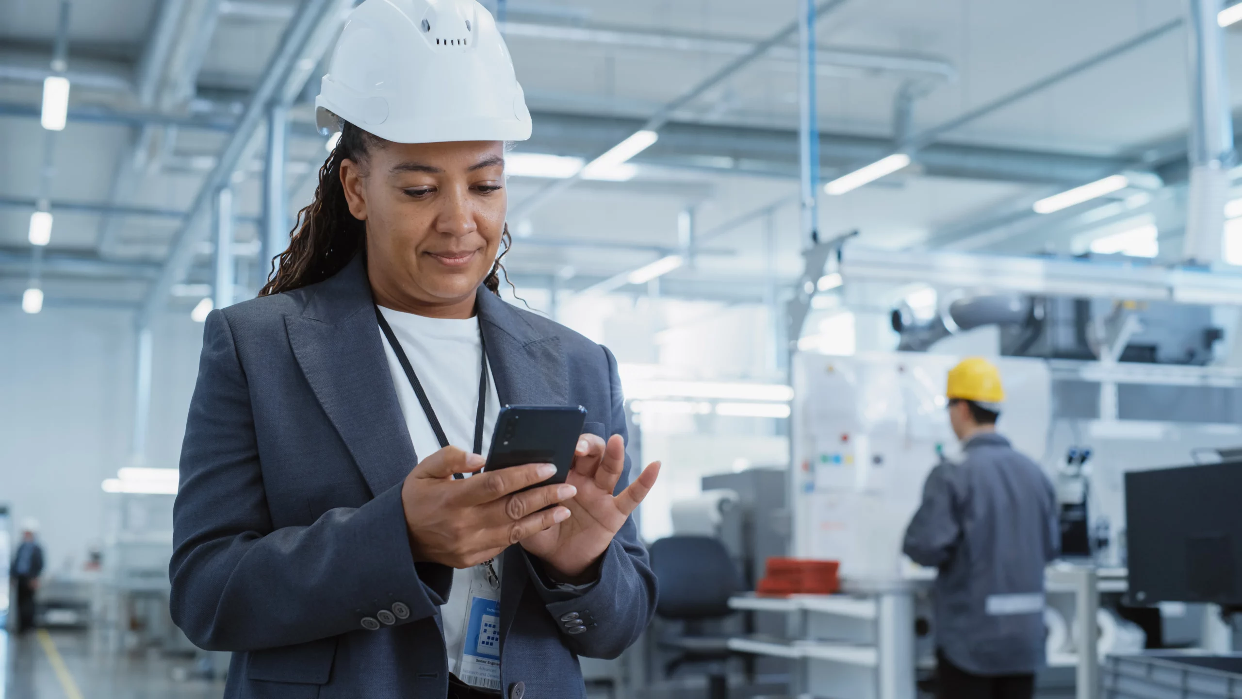 Manufacturing worker on phone