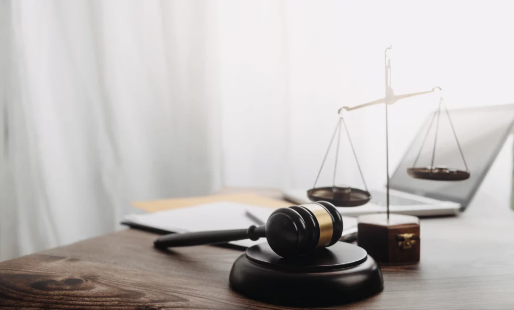 Desk with a laptop and gavel